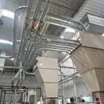 Complejo sistema de tuberías de aspiración en una instalación industrial para la recolección y transporte de partículas